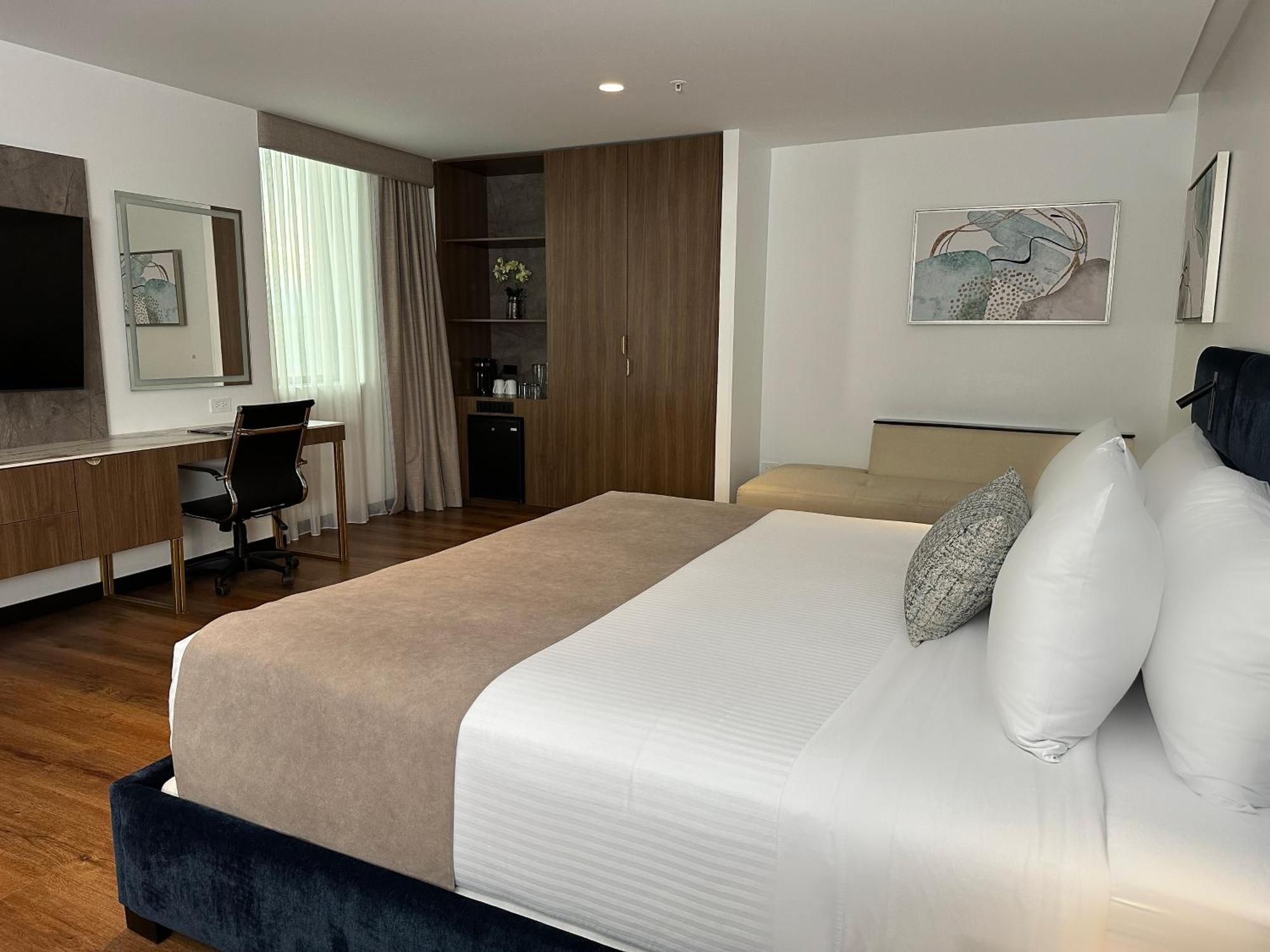 Wyndham Quito Airport Hotel Puembo Bagian luar foto A room at the hotel