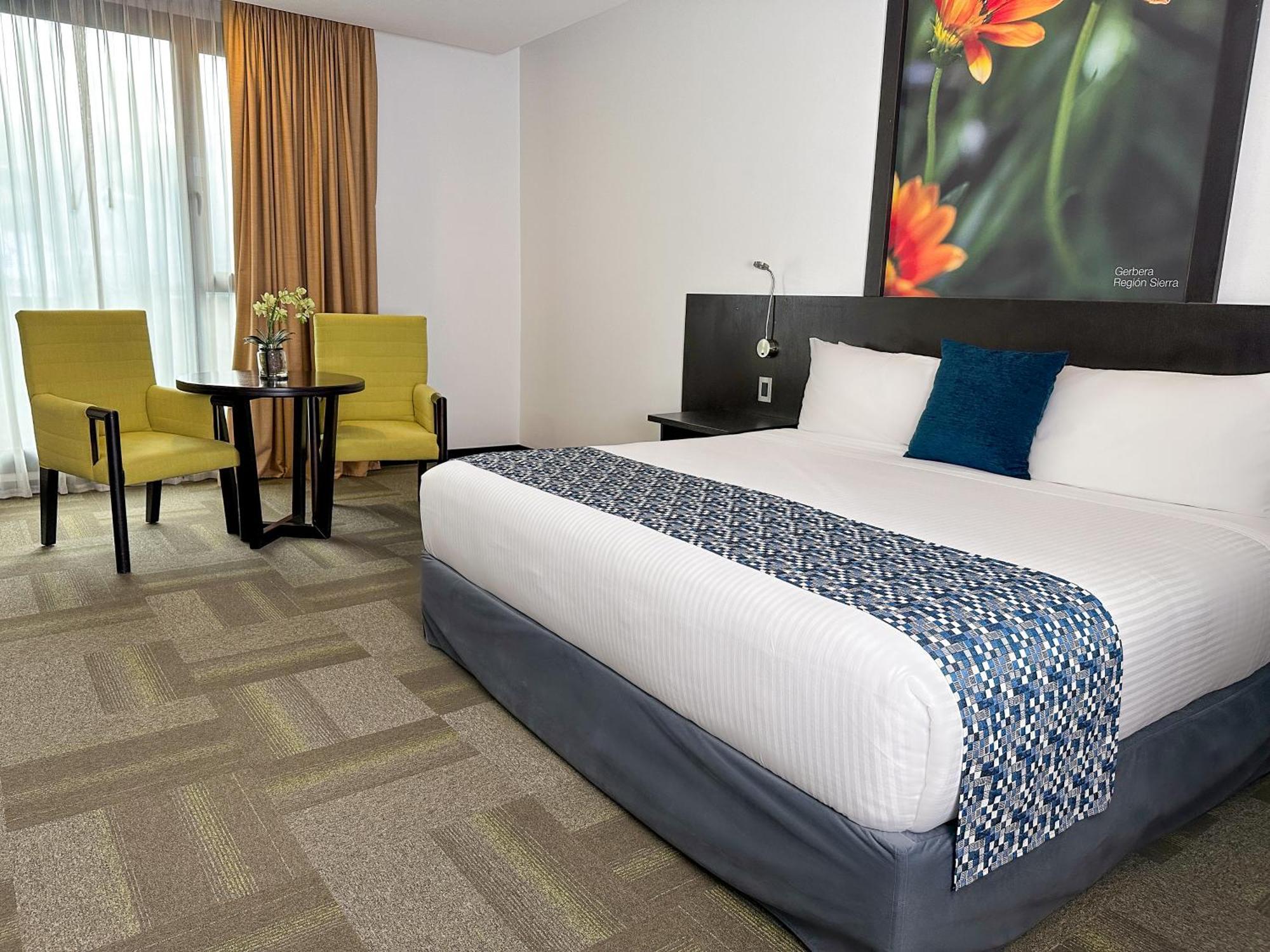 Wyndham Quito Airport Hotel Puembo Bagian luar foto A room at the hotel